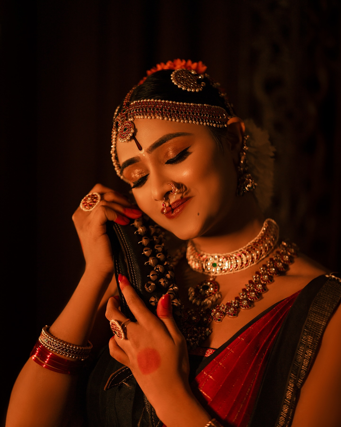 Close-up radiant smiling portrait in royal blue traditional attire