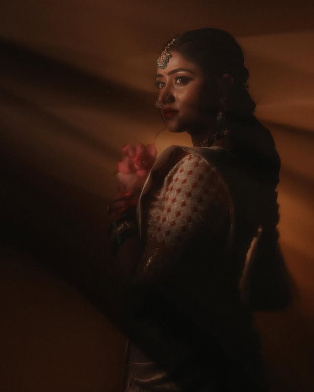 Striking pose in vibrant crimson red ethnic ensemble