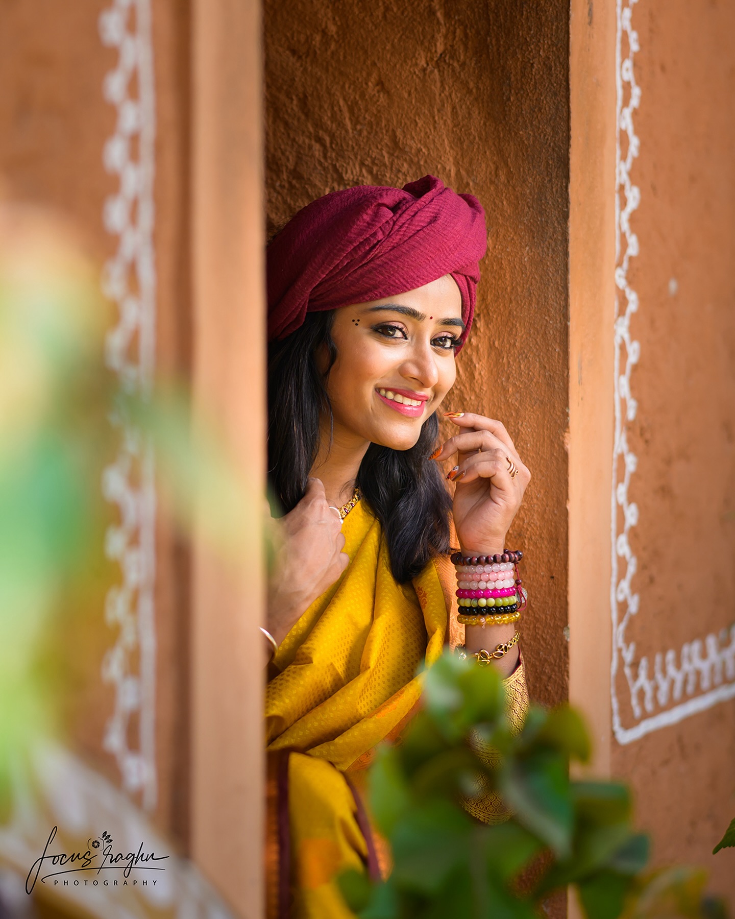 Contemplative seated portrait outdoors wearing a sheer white organza saree